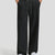 Men's black baggy sweatpants, front view. Wide leg sweatpants men, showing fit and drape.
