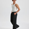 Men's black wide leg sweatpants, side view. Baggy pants men with roomy fit.