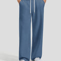 Men's blue baggy sweatpants, front view. Wide leg sweatpants men, showing fit and drape.