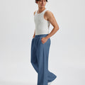 Men's blue wide leg sweatpants, side view. Baggy pants men with roomy fit.
