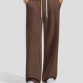 Men's coffee baggy sweatpants, front view. Wide leg sweatpants men, showing fit and drape.