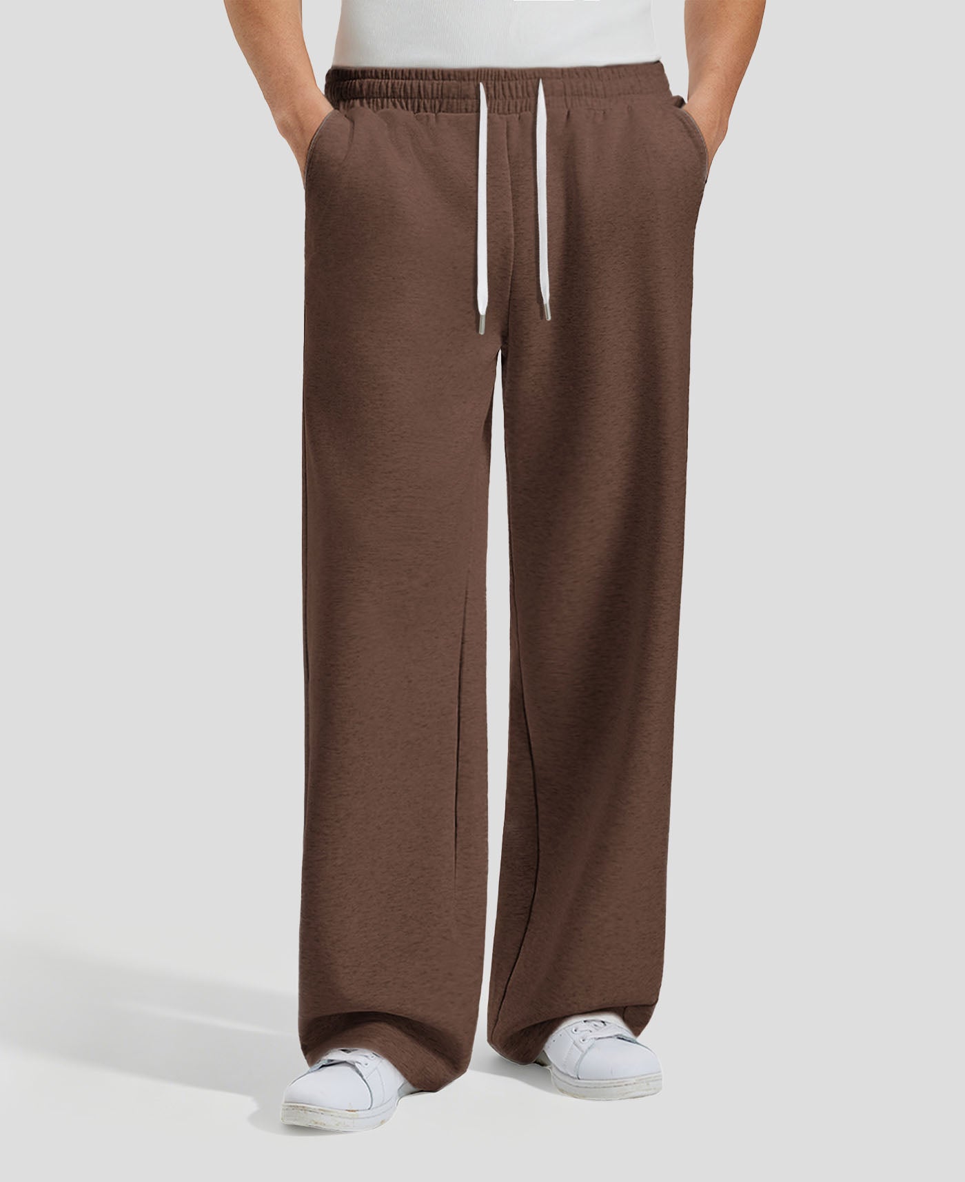 Men's coffee baggy sweatpants, front view. Wide leg sweatpants men, showing fit and drape.
