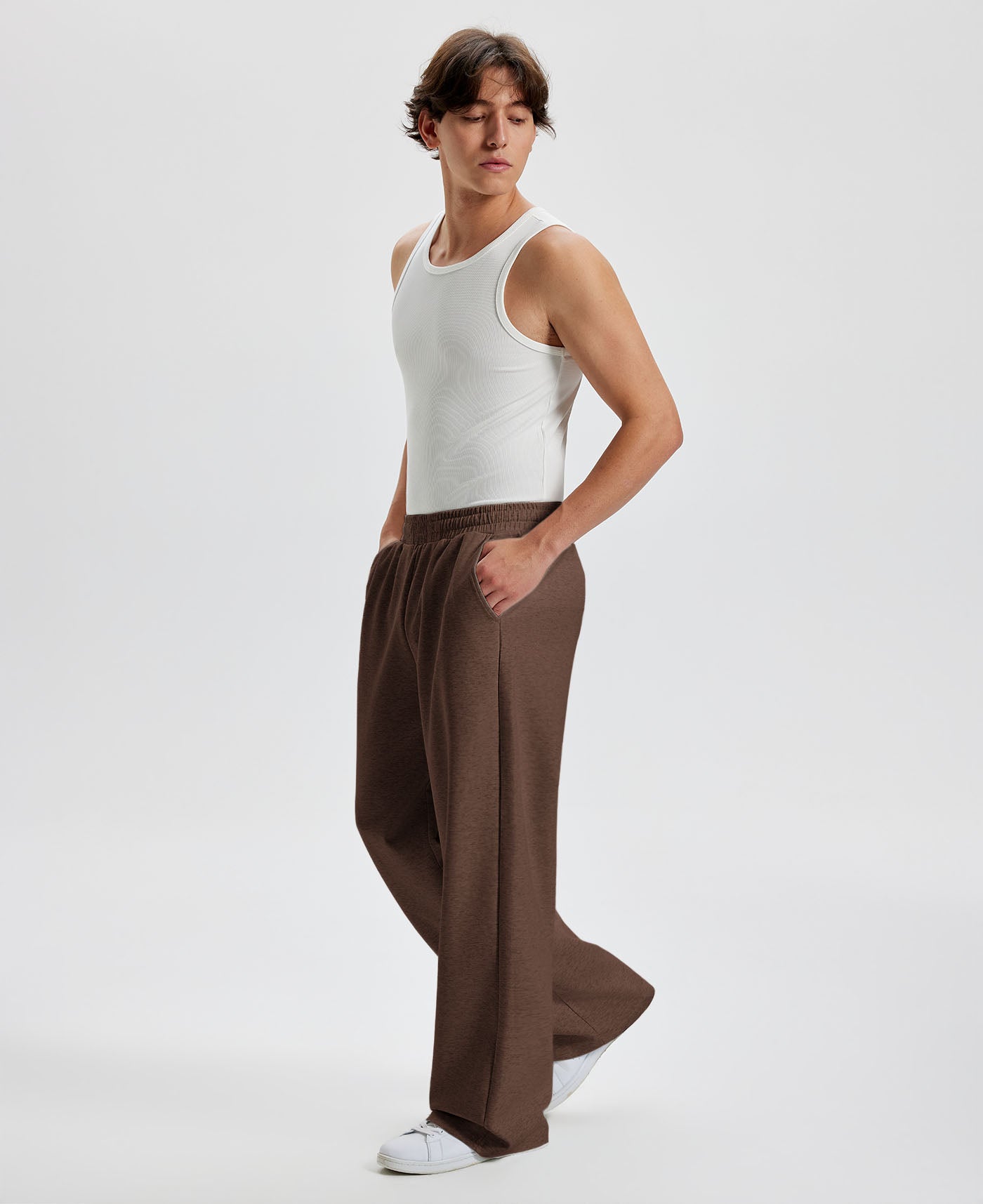 Men's coffee wide leg sweatpants, side view. Baggy pants men with roomy fit.