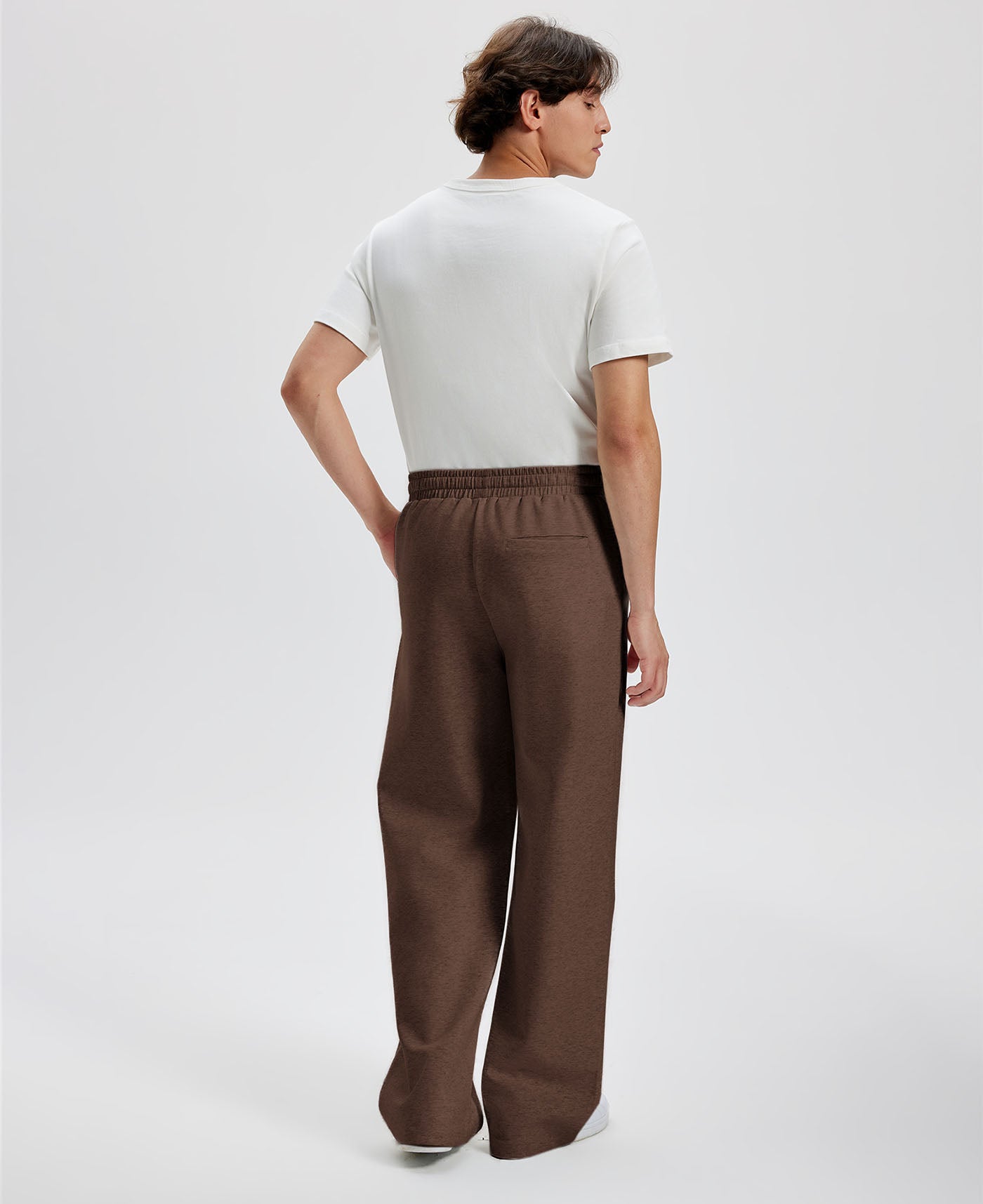 Cotton coffee sweatpants for men, back view. Elastic waistband and back pocket.
