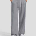 Men's dark grey baggy sweatpants, front view. Wide leg sweatpants men, showing fit and drape.