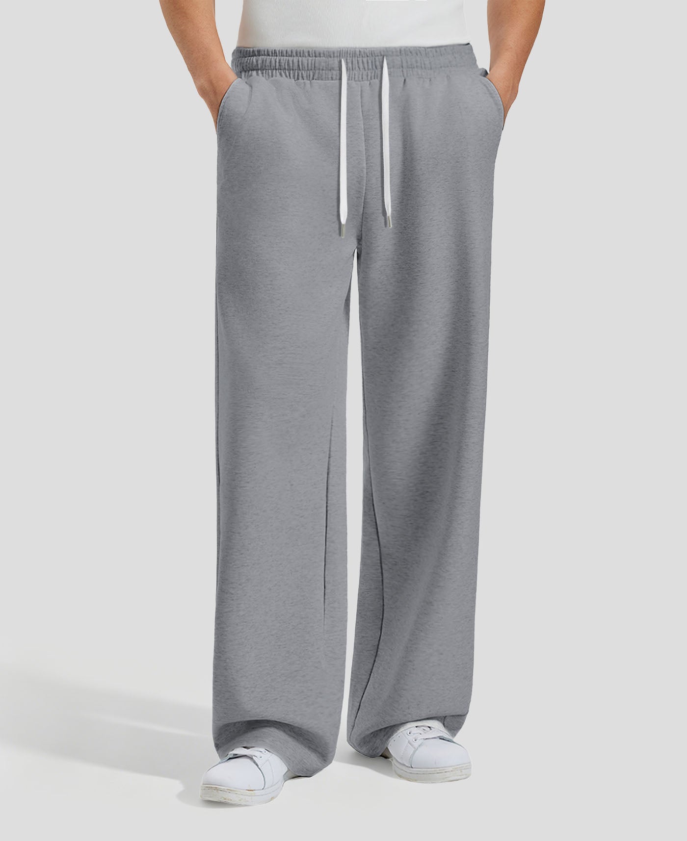 Men's dark grey baggy sweatpants, front view. Wide leg sweatpants men, showing fit and drape.