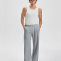 Loose fit dark grey sweatpants for men, full outfit. Casual men's sweatpants front look.