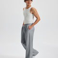 Men's dark grey wide leg sweatpants, side view. Baggy pants men with roomy fit.