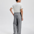 Cotton dark grey sweatpants for men, back view. Elastic waistband and back pocket.