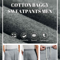 Men's dark grey baggy sweatpants details: fabric, drawstring, elastic waistband and pocket.