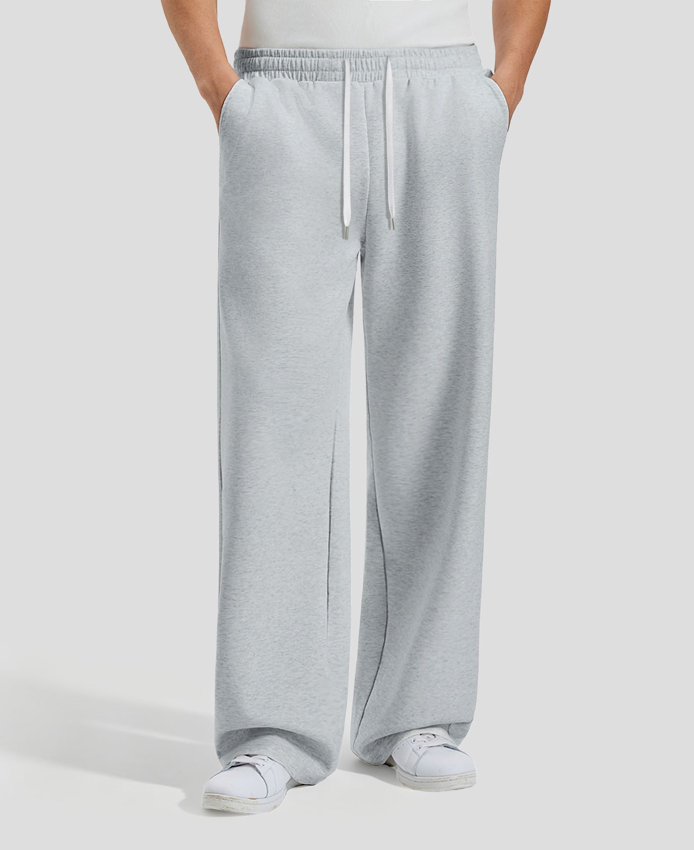 Men's light grey baggy sweatpants, front view. Wide leg sweatpants men, showing fit and drape.