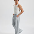 Men's light grey wide leg sweatpants, side view. Baggy pants men with roomy fit.