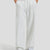 Men's white grey baggy sweatpants, front view. Wide leg sweatpants men, showing fit and drape.