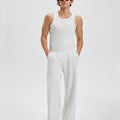 Loose fit white greye sweatpants for men, full outfit. Casual men's sweatpants front look.