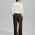 Back view of wide-leg trousers: elastic waistband and rear pockets ensure comfort without compromising silhouette.