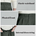 Key details: stretchy waistband, structured front pleats, hidden inner drawstring for personalized fit on men's dark grey dress pants.