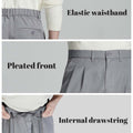 Key details: stretchy waistband, structured front pleats, hidden inner drawstring for personalized fit on men's light grey dress pants.