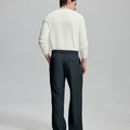 Back view of wide-leg trousers: elastic waistband and rear pockets ensure comfort without compromising silhouette.