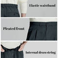 Key details: stretchy waistband, structured front pleats, hidden inner drawstring for personalized fit on men's navy dress pants.