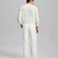 Back view of wide-leg trousers: elastic waistband and rear pockets ensure comfort without compromising silhouette.