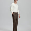 Side view of model with hand in pocket, highlighting the pleats and line of the Coffee Baggy Pleated Dress Pants for Men.