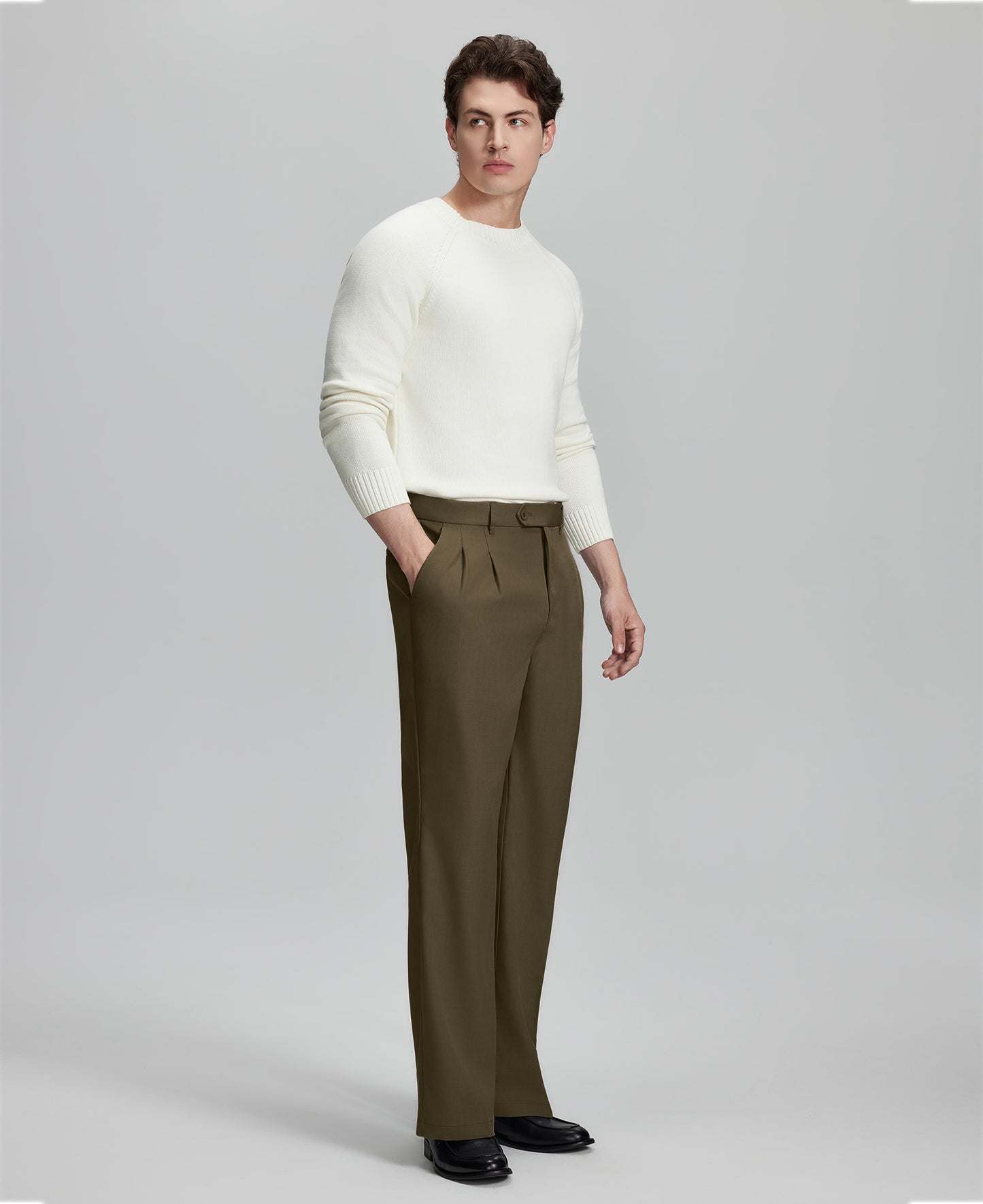 Back view of men's light brown dress pants showing elastic waistband and back pockets, emphasizing the silhouette of Extended Tab & Inner Drawstring design.
