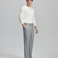 Side view of model with hand in pocket, highlighting the pleats and line of the Light Grey Baggy Pleated Dress Pants for Men.