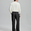 Back view showing elastic waistband and rear pockets on men's vintage-style black dress pants for enhanced comfort.