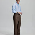 Back view showing elastic waistband and rear pockets on men's vintage-style coffee dress pants for enhanced comfort.