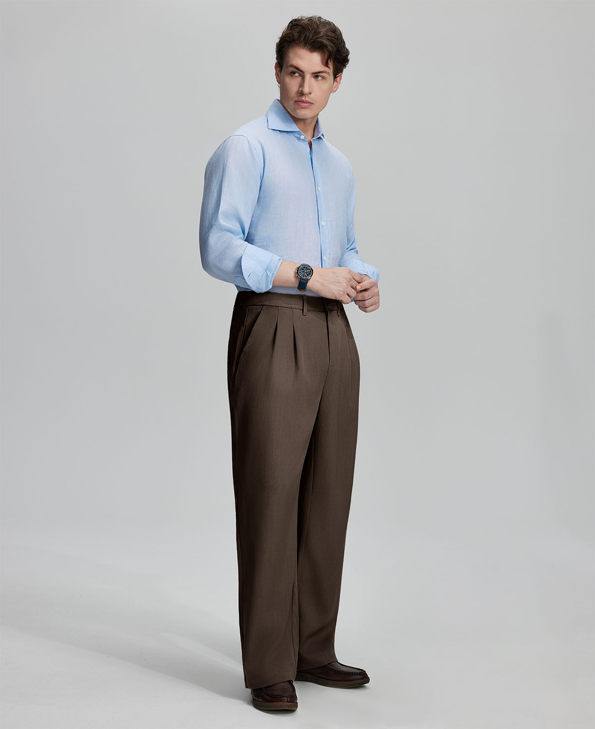 Back view showing elastic waistband and rear pockets on men's vintage-style coffee dress pants for enhanced comfort.