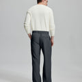 Back view showing elastic waistband and rear pockets on men's vintage-style dark gray dress pants for enhanced comfort.