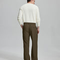 Back view showing elastic waistband and rear pockets on men's vintage-style light brown dress pants for enhanced comfort.