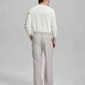 Back view showing elastic waistband and rear pockets on men's vintage-style stone grey dress pants for enhanced comfort.