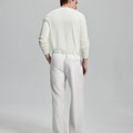 Back view showing elastic waistband and rear pockets on men's vintage-style white dress pants for enhanced comfort.