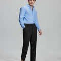 Model in light blue shirt and black Men's Corduroy Dress Pants, showcasing smart business casual style.