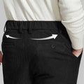 Back view of Men's Corduroy Dress Pants with detailed back pocket design for a refined look.