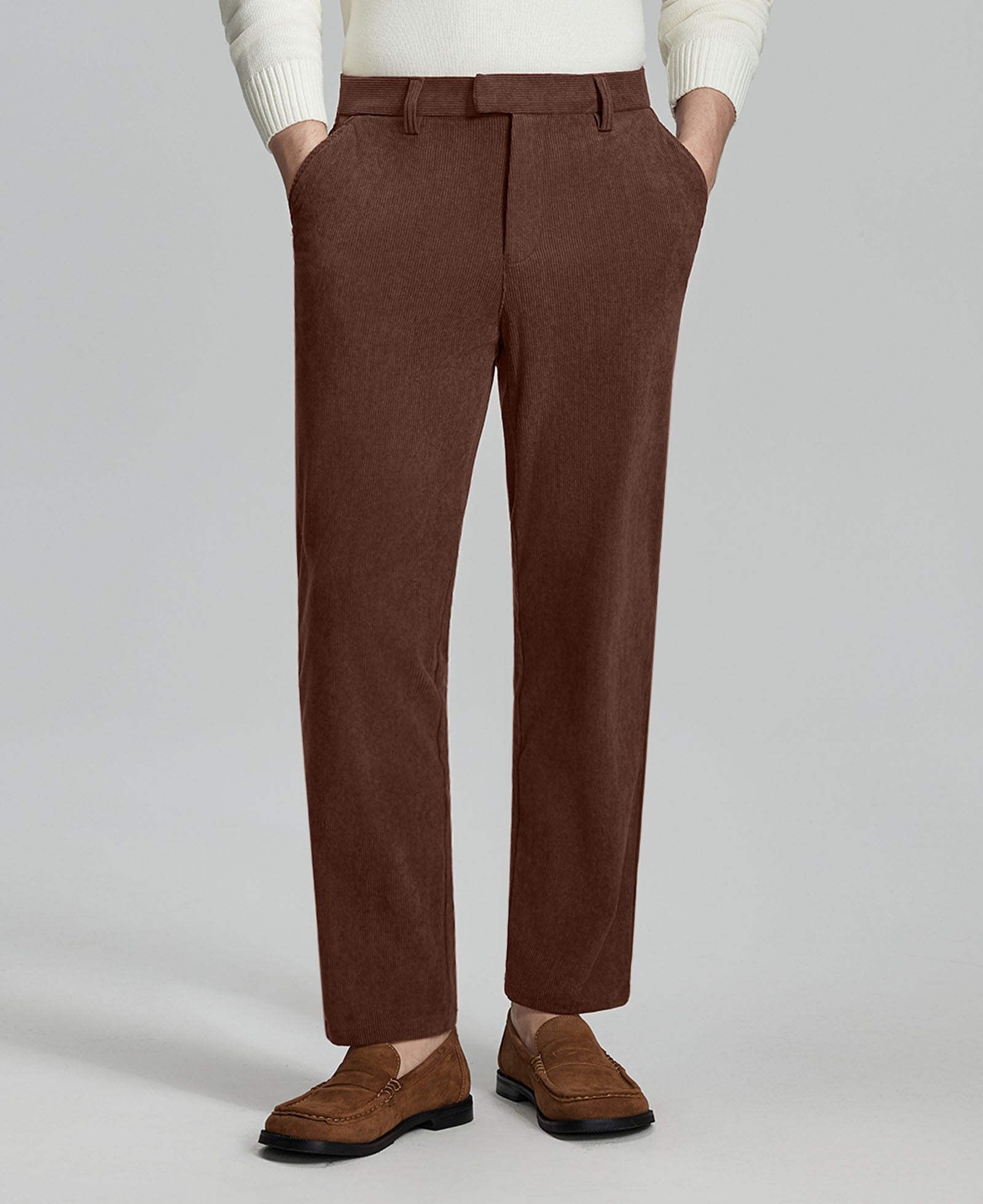 Man in white sweater, coffee Men's Corduroy Dress Pants, and brown loafers showing fabric texture and drape.