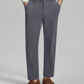 Man in white sweater, grey Men's Corduroy Dress Pants, and brown loafers showing fabric texture and drape.