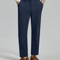 Man in white sweater, navy Men's Corduroy Dress Pants, and brown loafers showing fabric texture and drape.