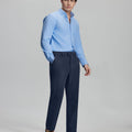 Model in light blue shirt and navy Men's Corduroy Dress Pants, showcasing smart business casual style.