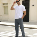 Man adjusting sunglasses, revealing side pocket details of dark grey multipants, highlighting fit and pocket layout.