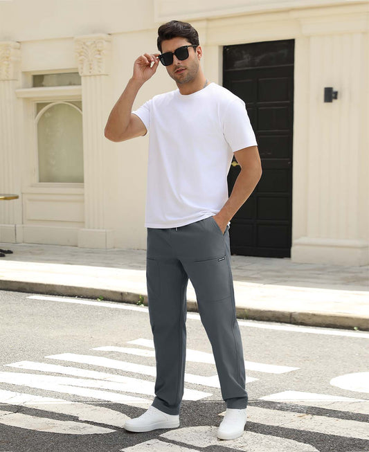 Man adjusting sunglasses, revealing side pocket details of dark grey multipants, highlighting fit and pocket layout.