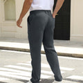 Back view of pants showing rear pocket design and overall silhouette, man with hand in back pocket for storage detail.