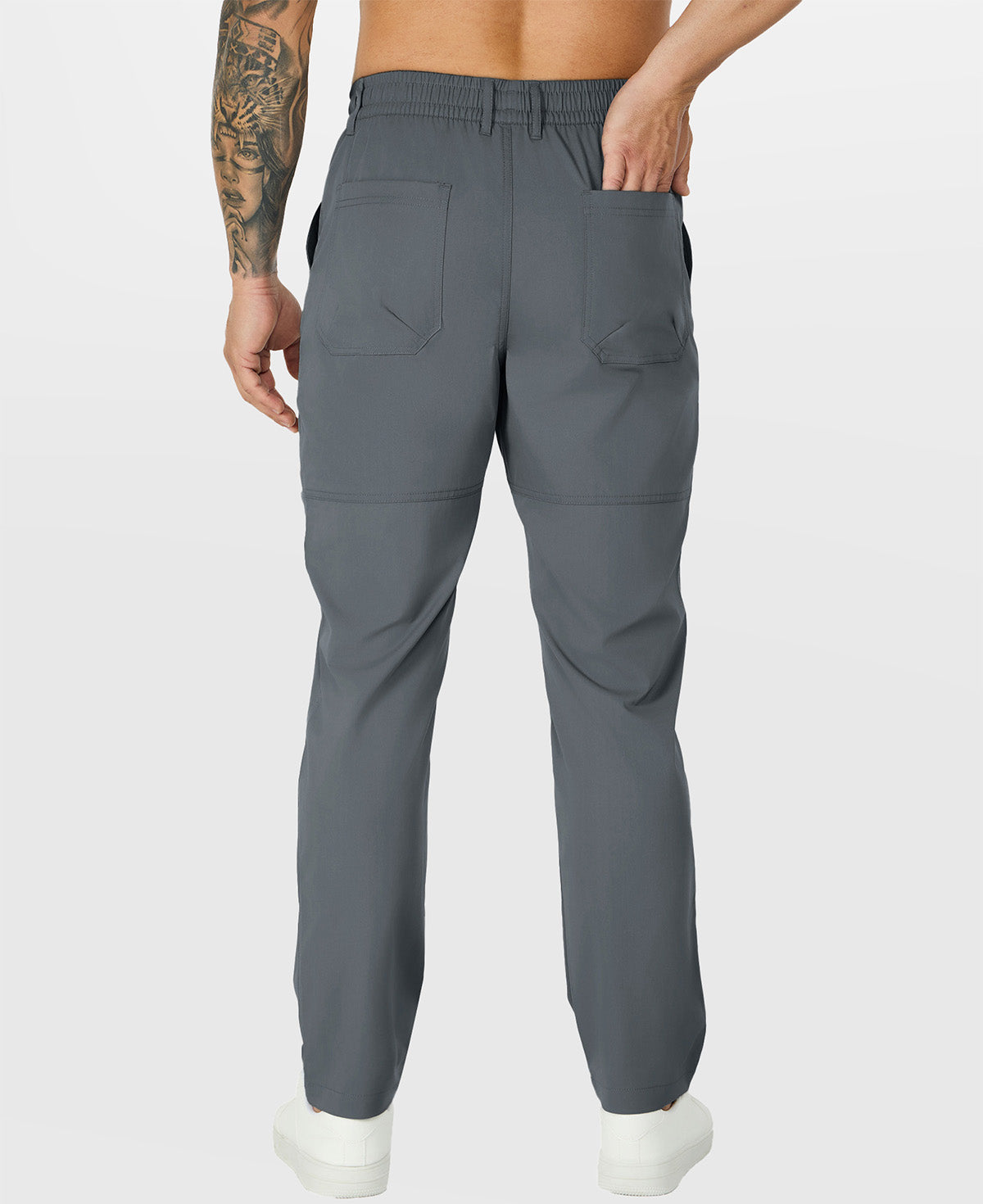 Close-up of back pocket and elastic waistband, emphasizing storage functionality and comfort in multipants.