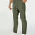 Man in green multipants with drawstring waist and multiple pockets, white sneakers, hand in pocket showing side logo.