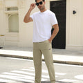 Man adjusting sunglasses, revealing side pocket details of khaki multipants, highlighting fit and pocket layout.