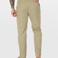 Close-up of back pocket and elastic waistband, emphasizing storage functionality and comfort in multipants.