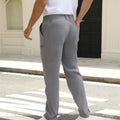Back view of pants showing rear pocket design and overall silhouette, man with hand in back pocket for storage detail.