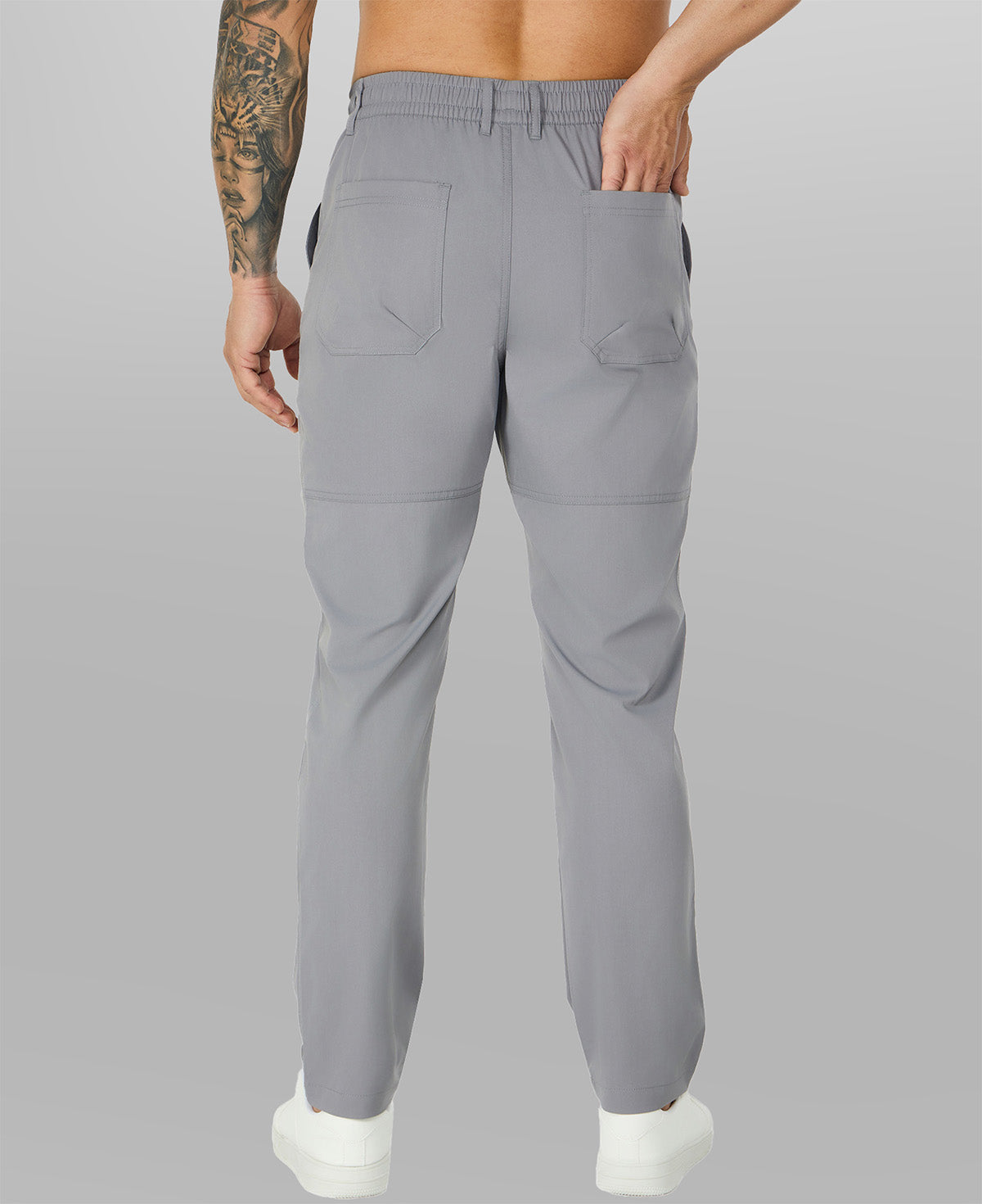 Close-up of back pocket and elastic waistband, emphasizing storage functionality and comfort in multipants.