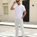 Man adjusting sunglasses, revealing side pocket details of white multipants, highlighting fit and pocket layout.